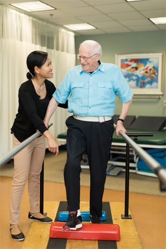 Physical therapy with senior man at StoneRidge Senior Living