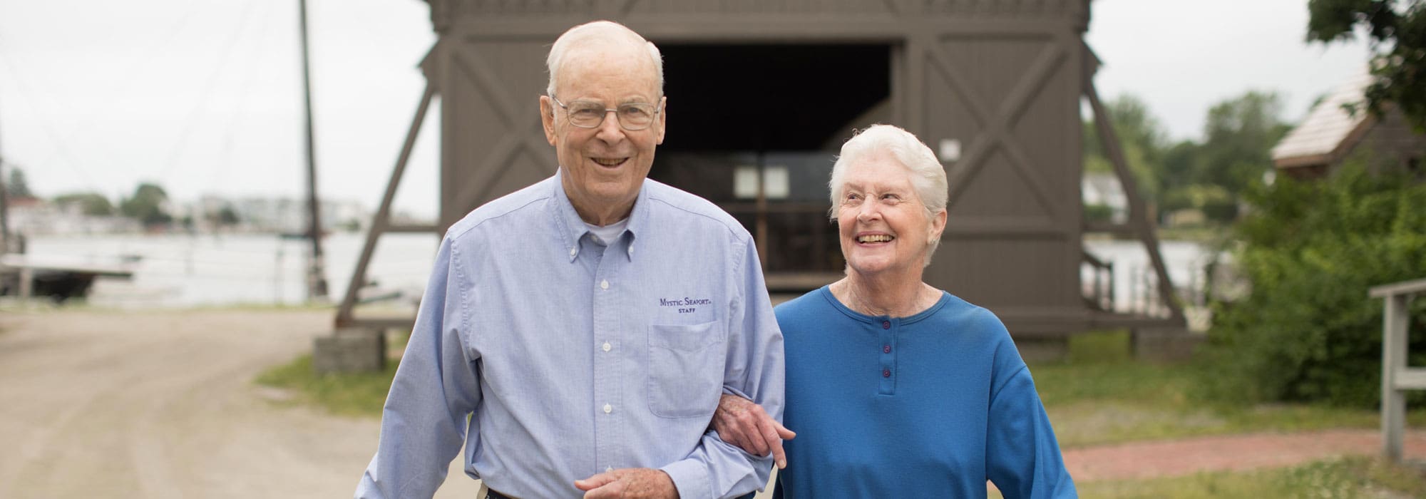 Senior couple walking outside at StoneRidge Senior Independent Living
