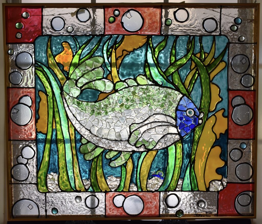 A combination of stained-glass paint and sea glass collected from local beaches. 