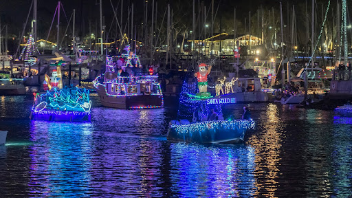 festive lighted boats on water
