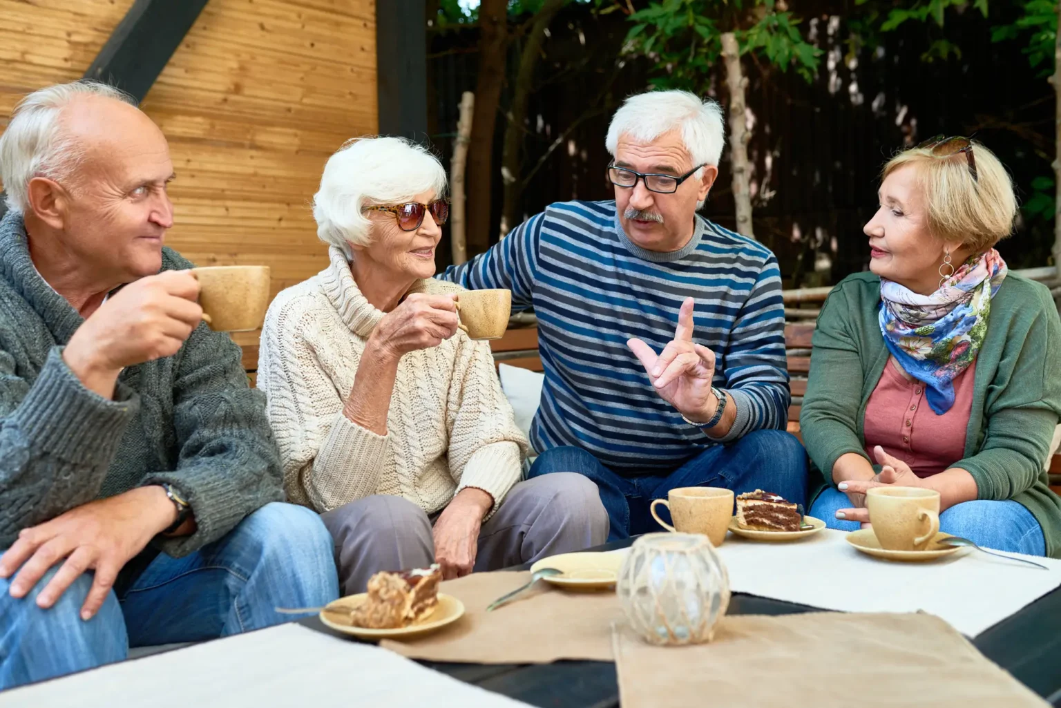 group of older adults enjoy coffee and desserts