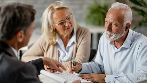 senior couple meeting with an elder law attorney